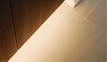 Carregar imagem no visualizador da galeria, Nordlux LED strip lighting under a wooden cabinet with a YouTube video player overlay.
